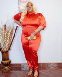 Front view of plus size red two piece satin set with high neck and fitted silhouette