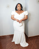 Feminine plus size white occasion dress with V-neckline