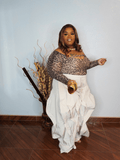 Leopard keyhole long sleeve stretch top side view for plus size women styled with statement wide leg pants