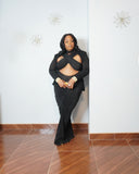Plus size bodycon gown styled with gold accessories