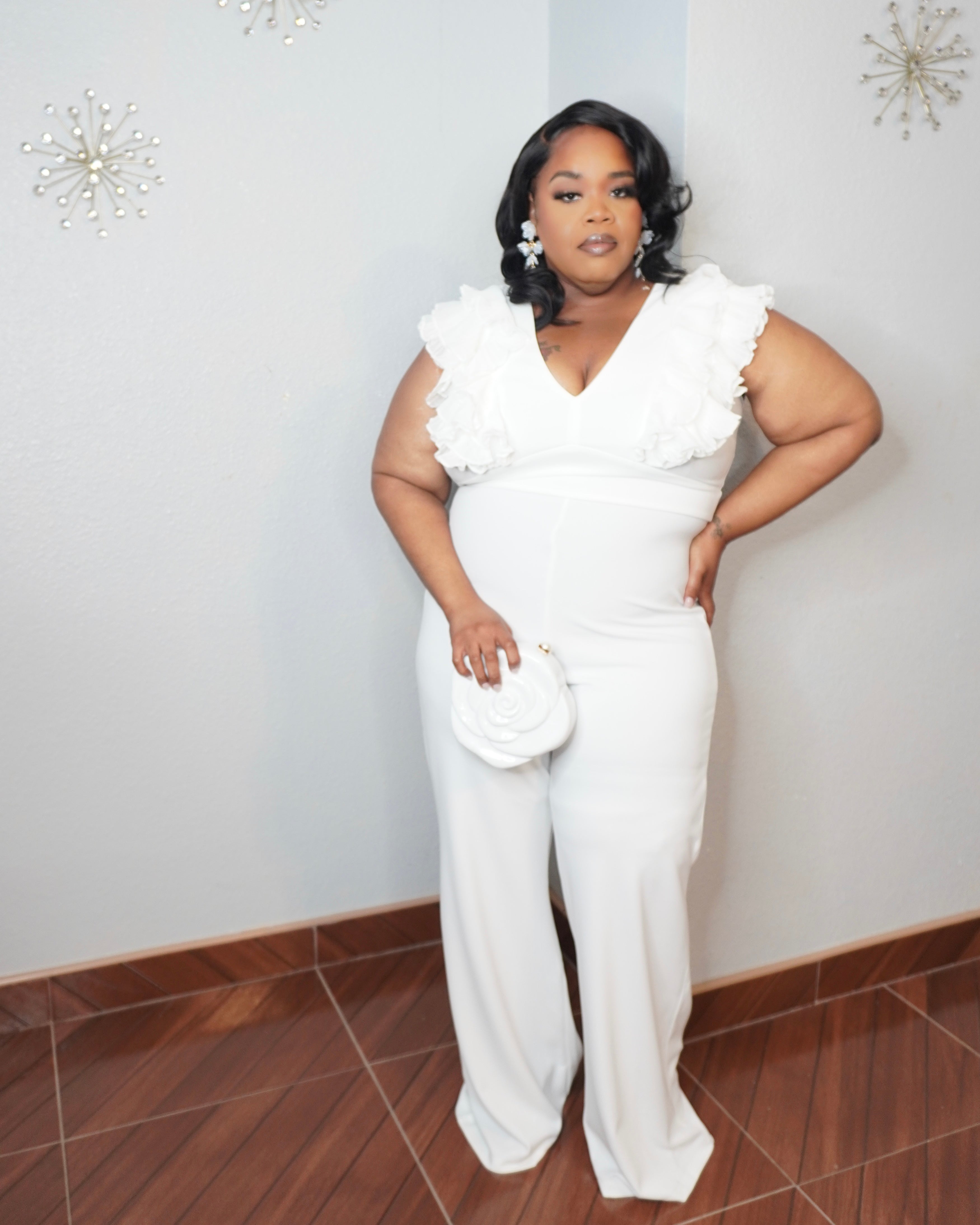 Plus size white ruffle sleeve jumpsuit with wide leg fit