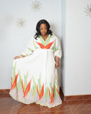 Curvy woman modeling elegant tropical print vacation maxi dress