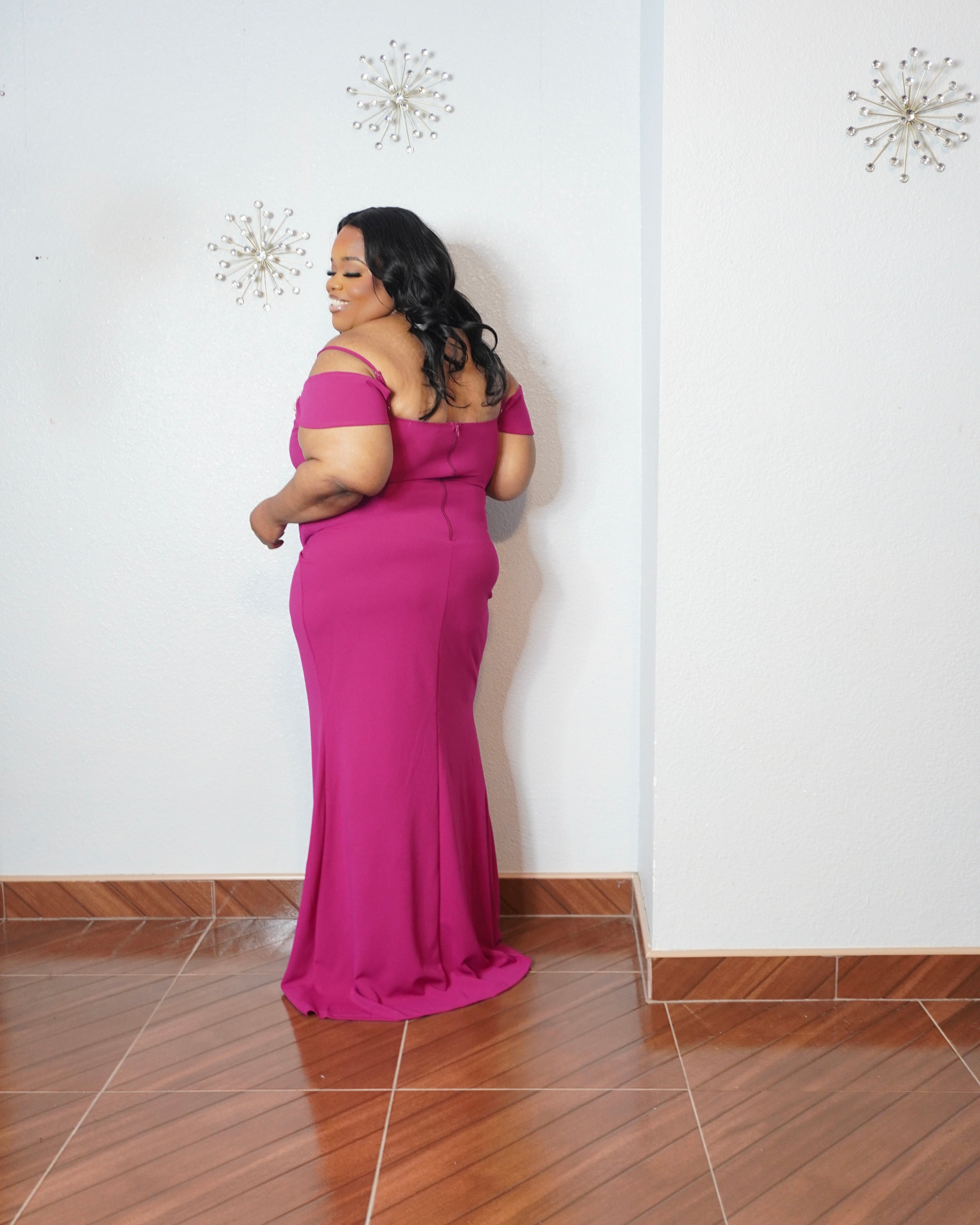 Back view of magenta plus size formal dress with floor length design