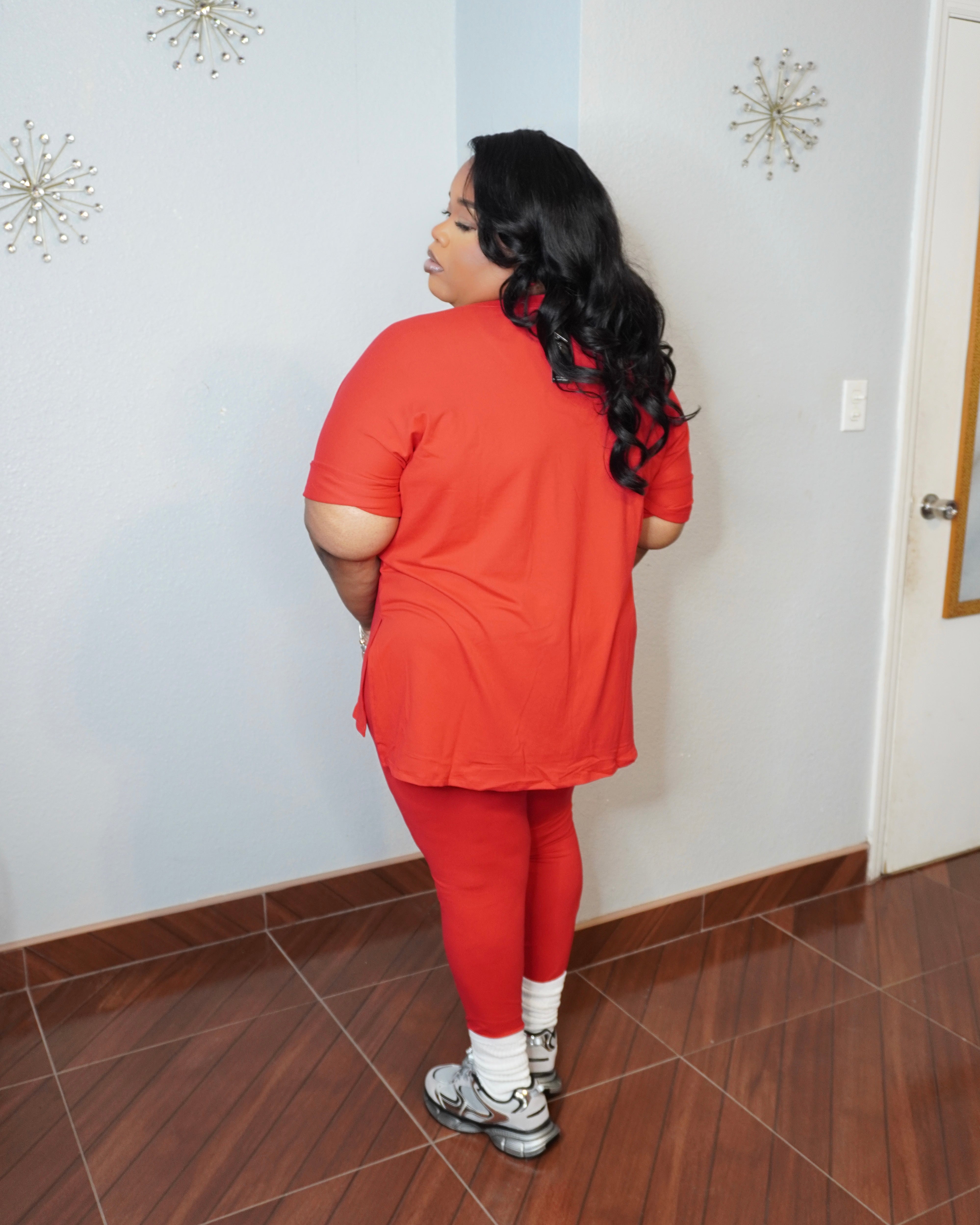 Back view of plus size V-neck top and fitted leggings set