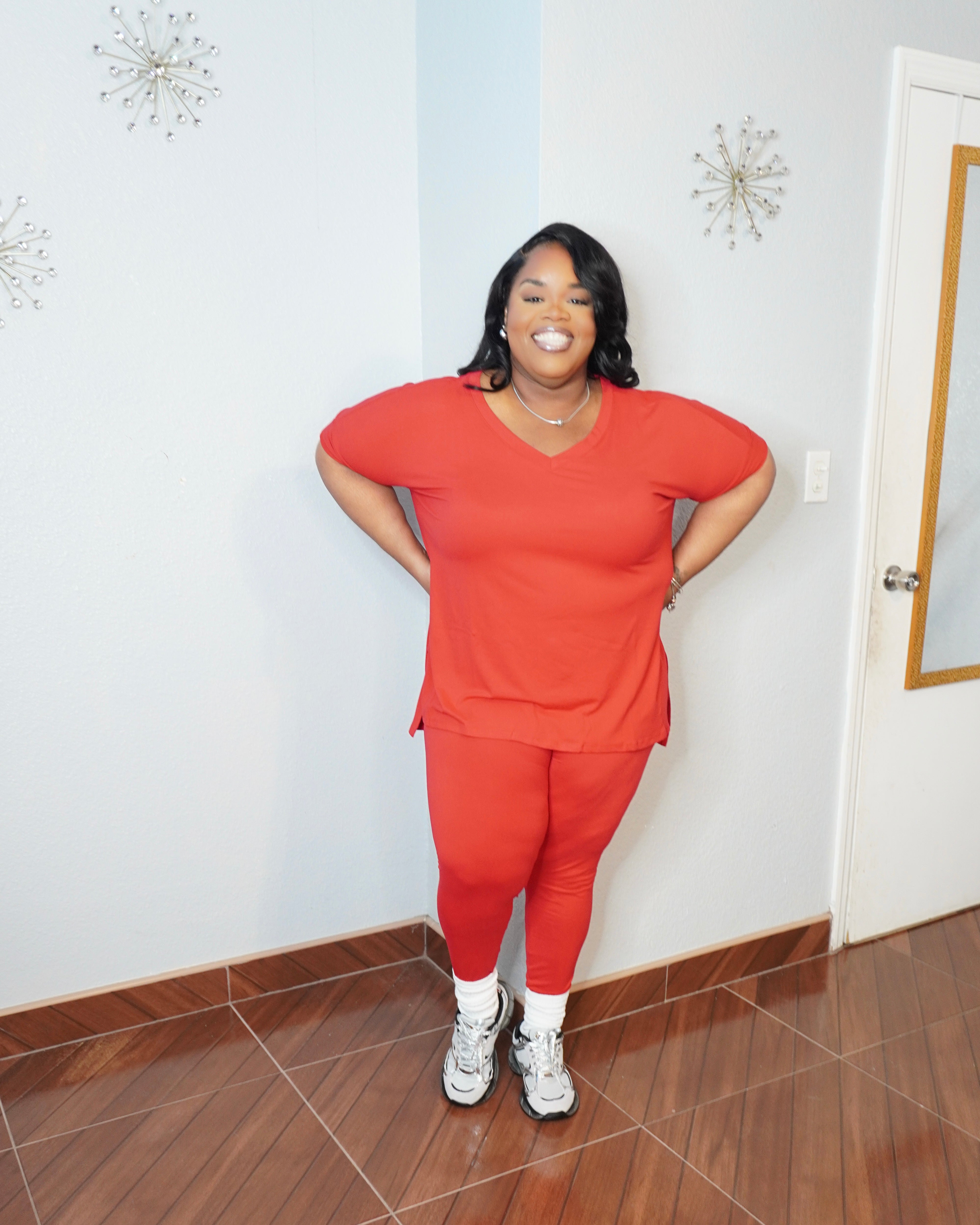 Side view of plus size legging set showing stretch and relaxed fit top