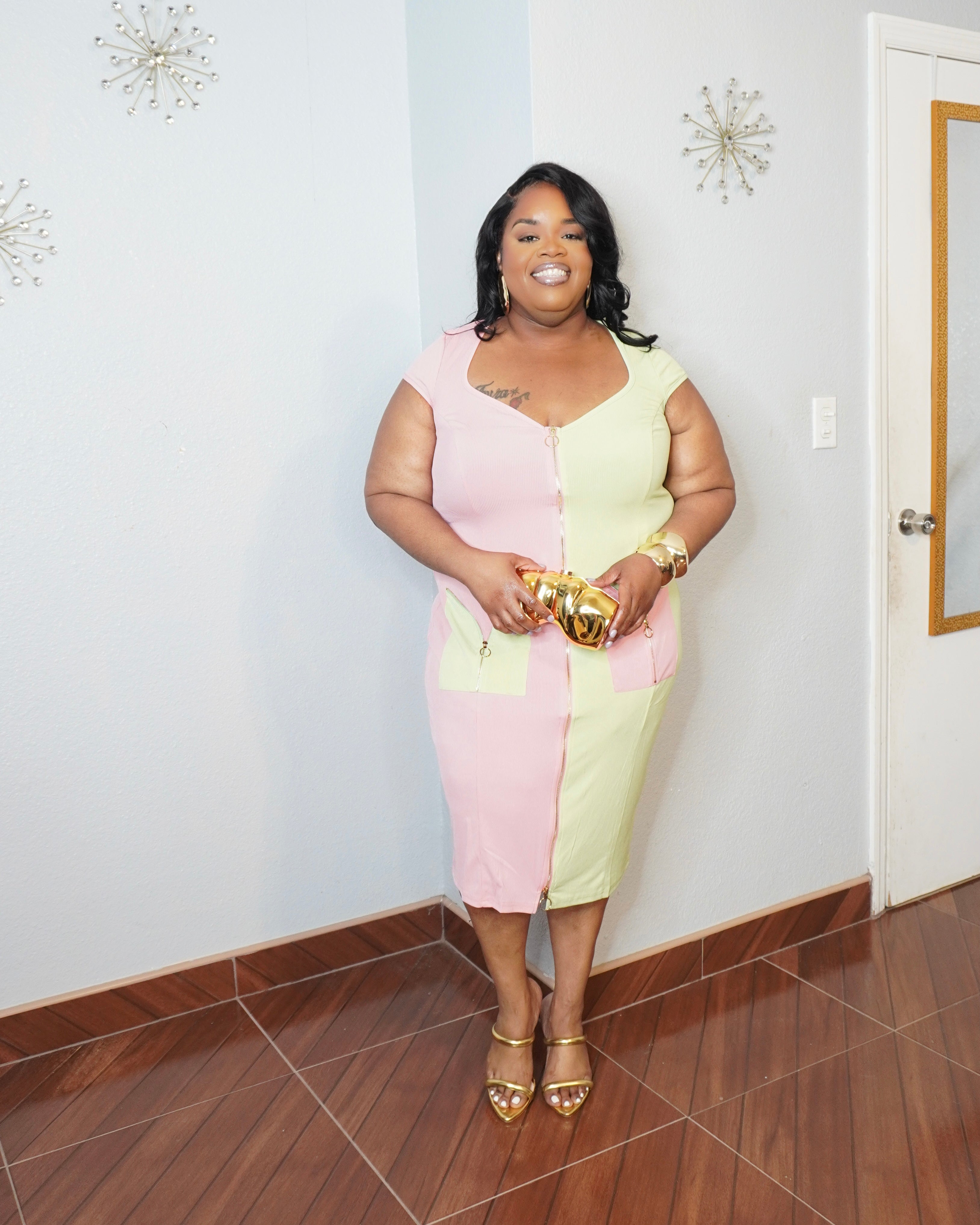Plus size two tone zip front dress with gold accessories
