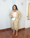 Full body view of plus size blazer set showing relaxed fit trousers and cropped jacket