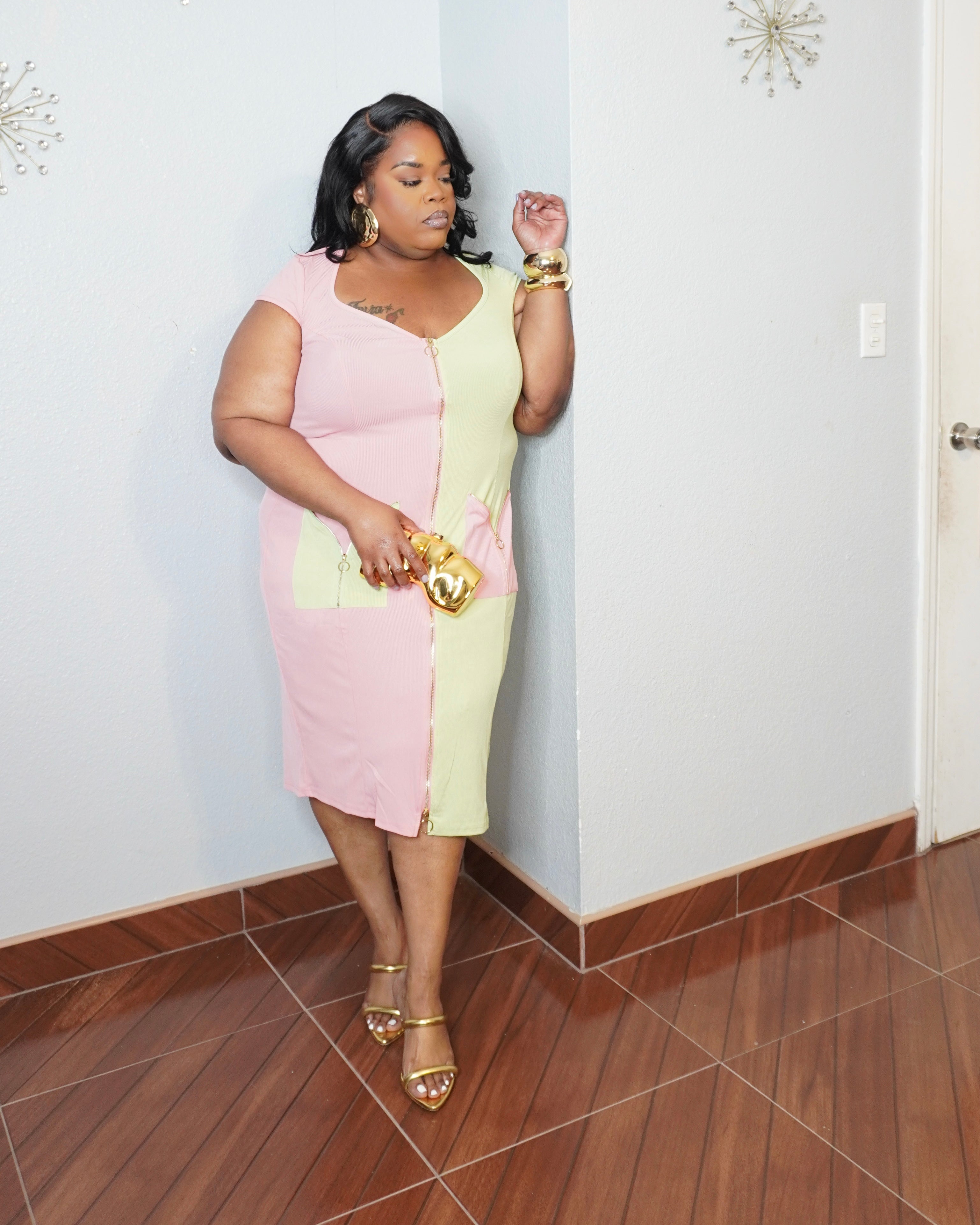 Curve hugging ribbed midi dress side pose plus size