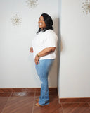Side view of white relaxed fit plus size stretch top.