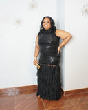 Front full-length view of burgundy sequin formal gown with elegant layered hem