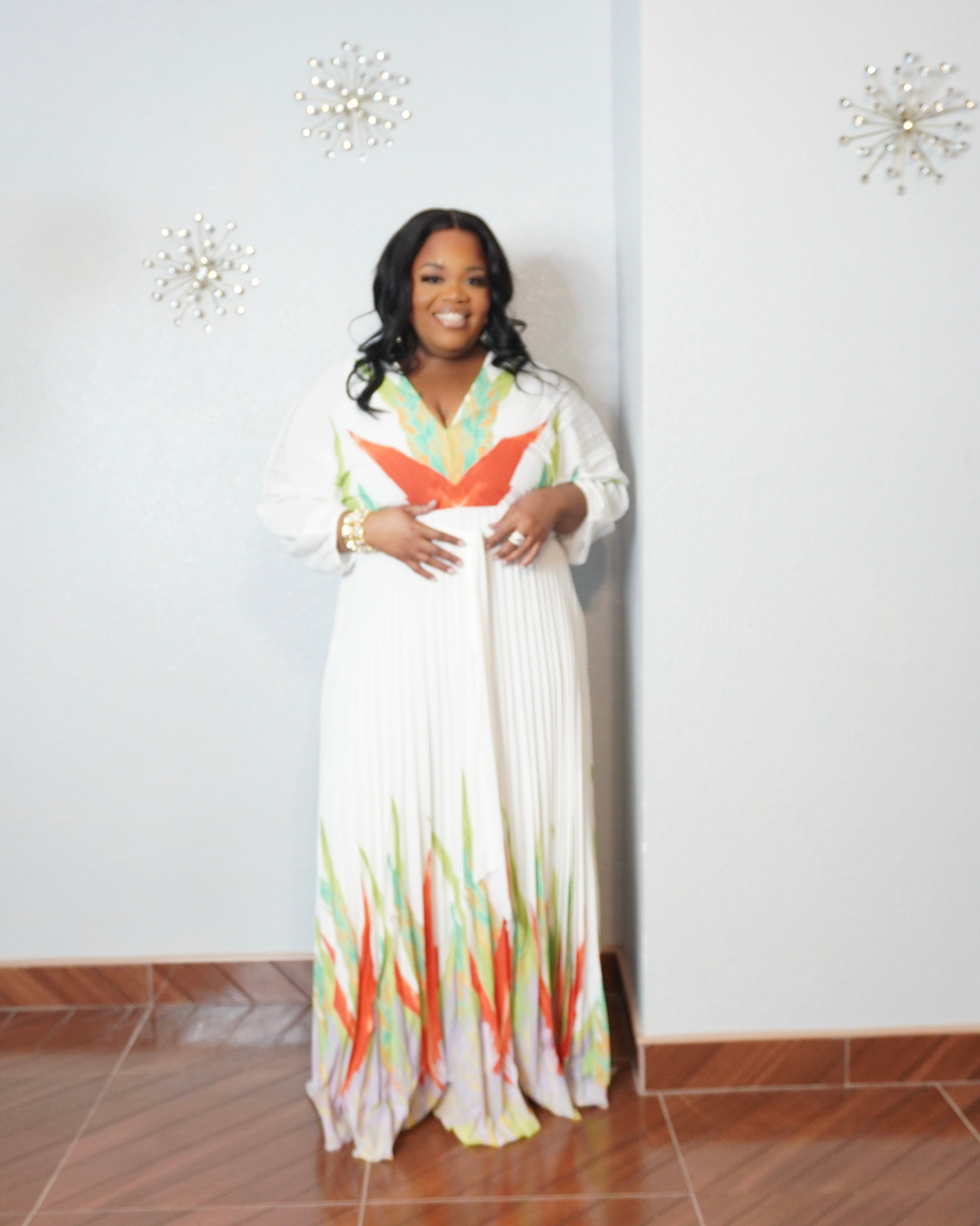 Plus size resort wear dress with airy pleated fabric and empire waist