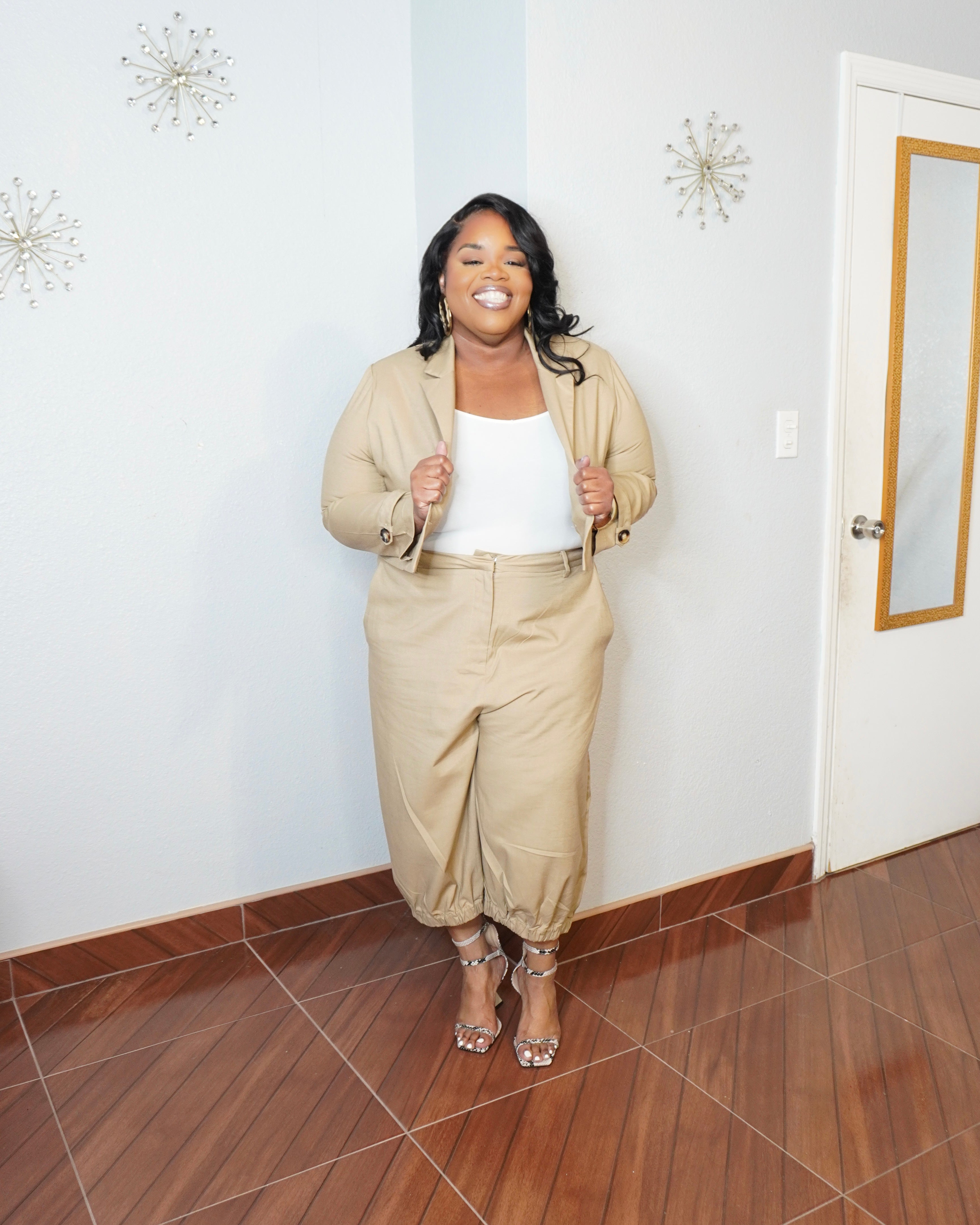 Front view of plus size neutral set highlighting structured blazer fit