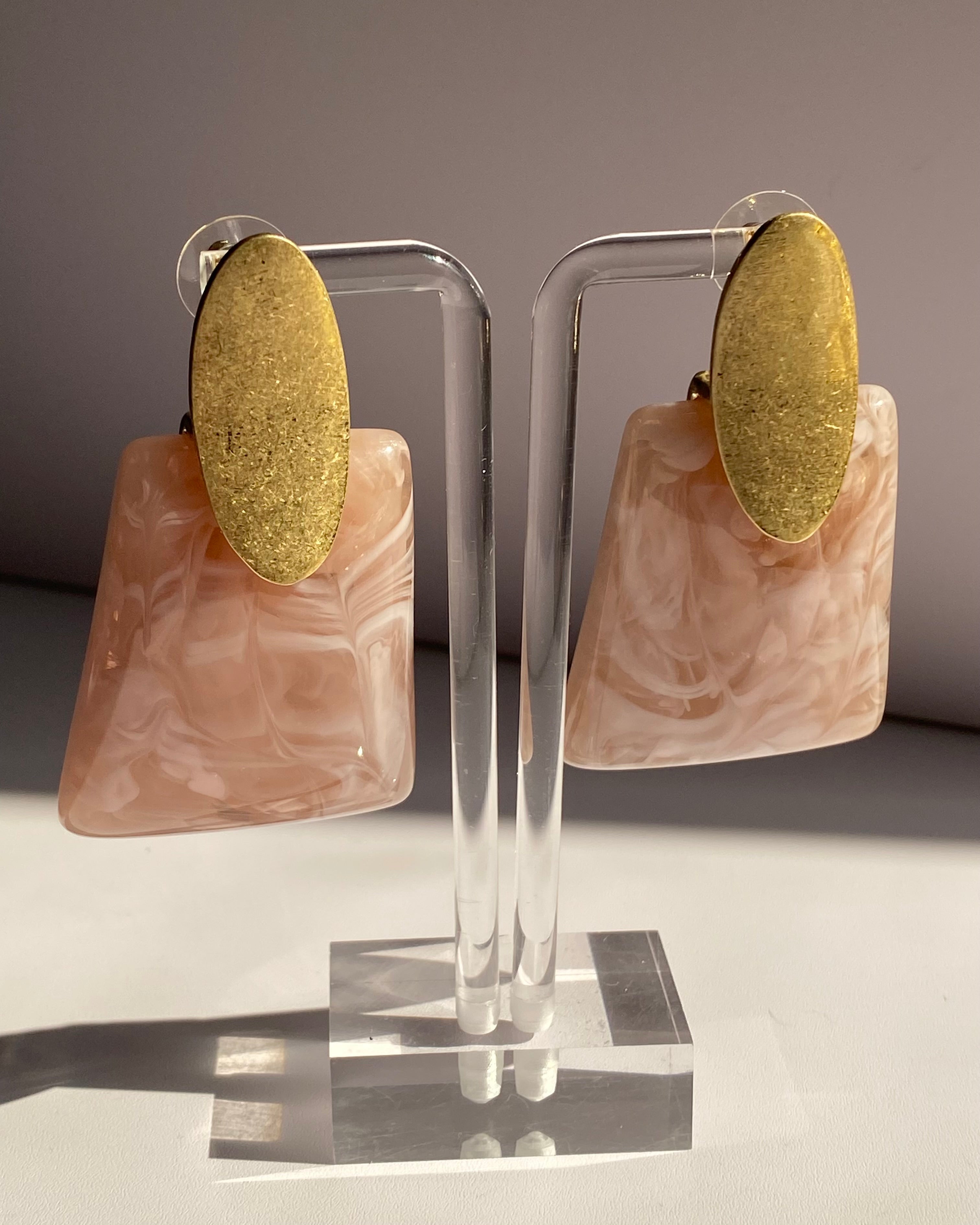 Blush pink marbled resin statement earrings with brushed gold oval studs.
