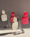 Lightweight acrylic statement earrings available in two elegant color variations.