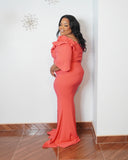 Side view of plus size evening gown with curve-enhancing silhouette and ruffle sleeves