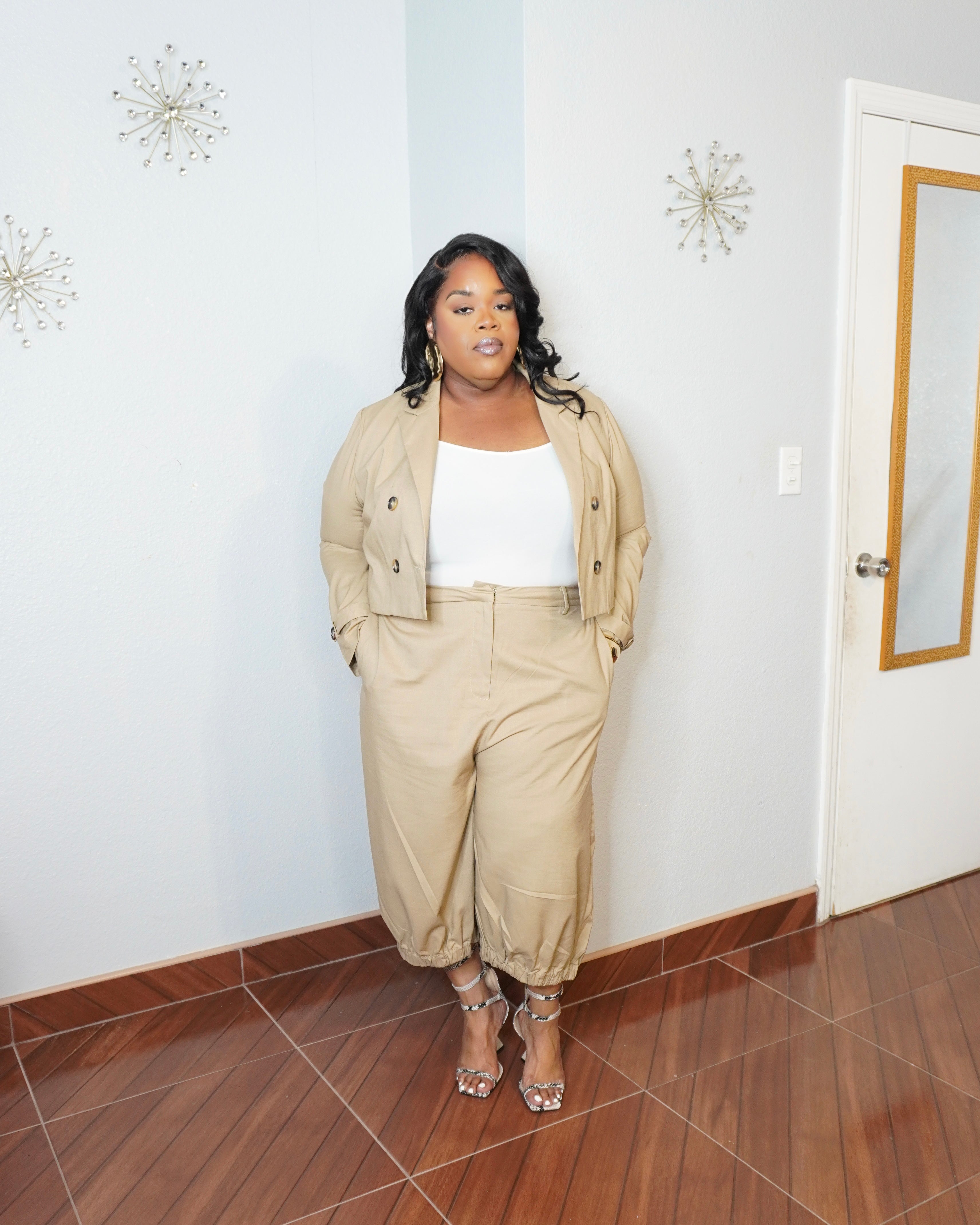 Front view of plus size neutral set highlighting structured blazer fit